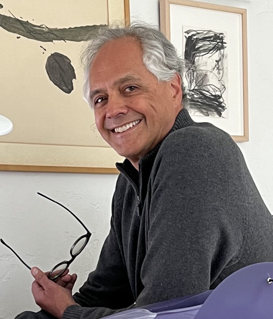 Dr. Henri Colt at his desk in Laguna Beach, CA