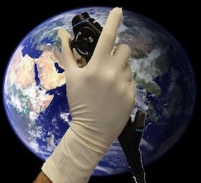 earth with hand holding bronchoscope